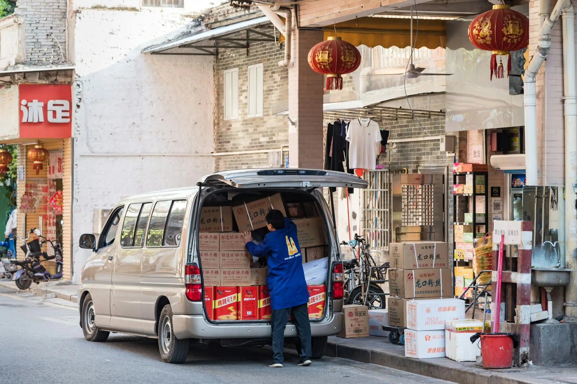 Tradesman standing beside a white work van, a self-employed owner looking at low doc loans